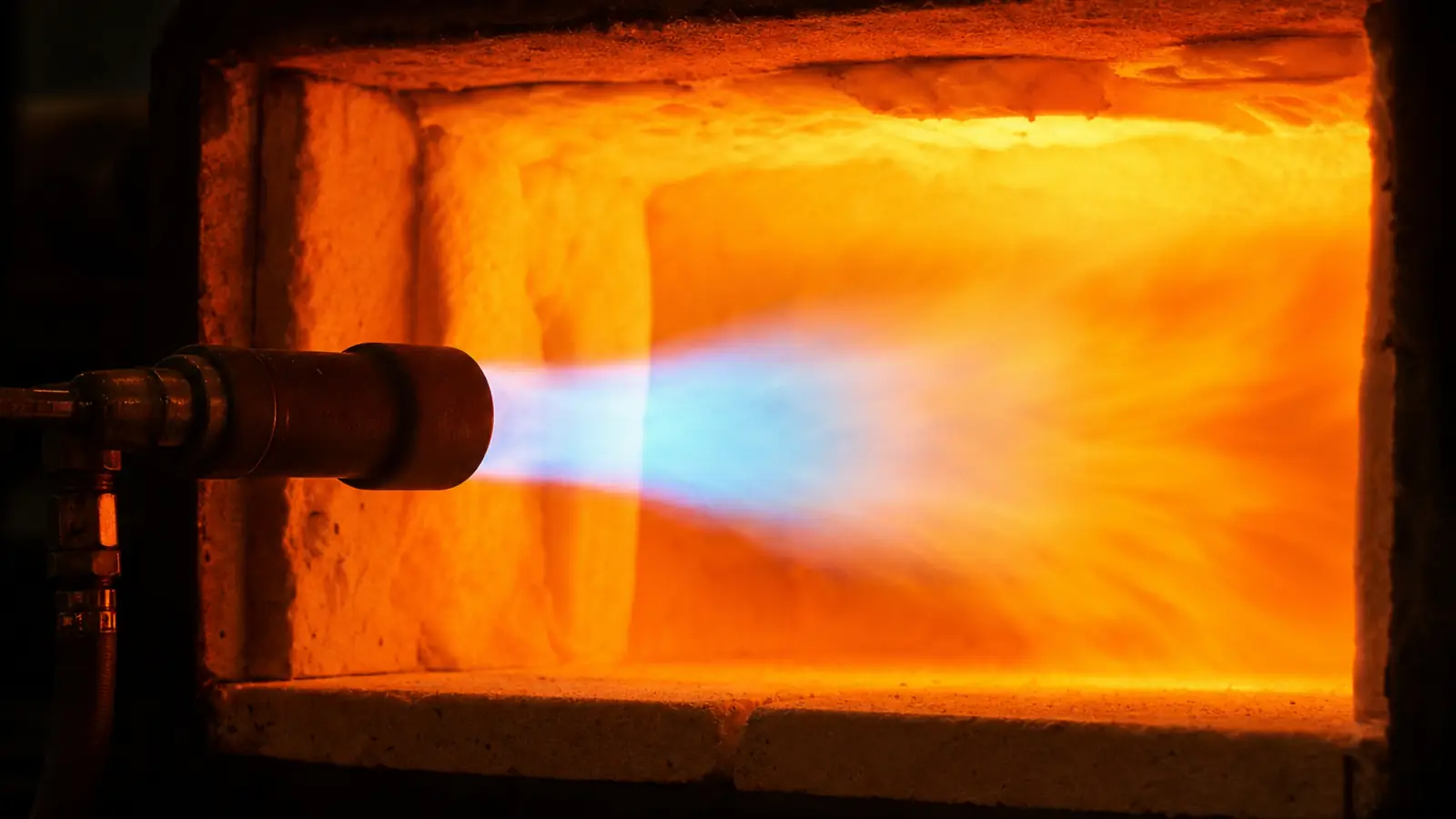 Propane forge burner flame roaring inside a forge chamber